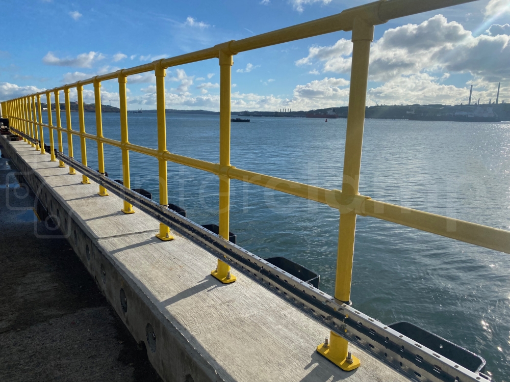 Interclamp tube clamp fittings used to construct a double rail barrier on a busy jetty. The fittings and tube were also powder coated in safety yellow to enhance durability and visibility.